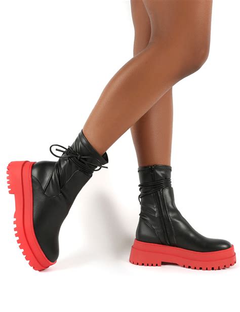 black boots with red bottom.